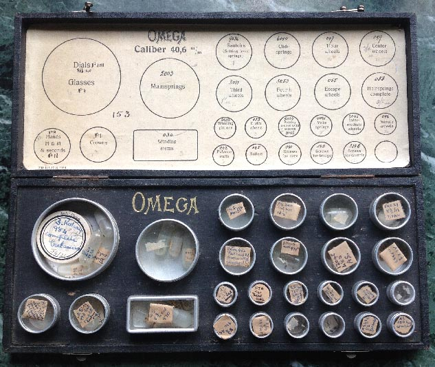 antique Omega watch parts case with aluminium and glass containers